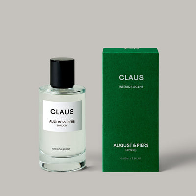 AUGUST&PIERS CLAUS room spray in glass bottle and green box with – festive home fragrance with pine and cinnamon notes.