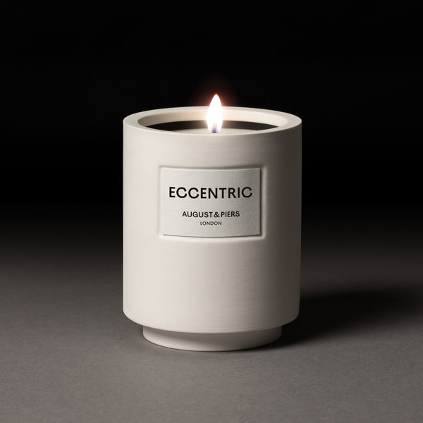 AUGUST&PIERS 340g Eccentric scented candle with fragrance notes of blood orange, maple syrup and bourbon in white ceramic vessel.