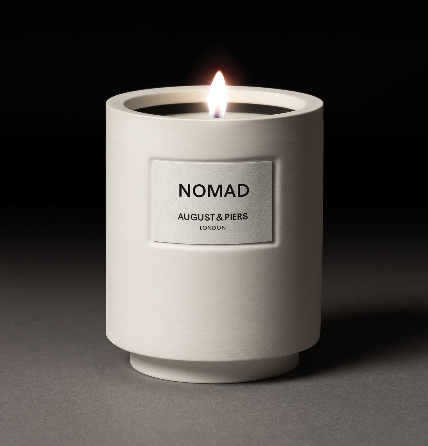 Luxury home fragrance by AUGUST&PIERS London – NOMAD scented candle in minimalist white ceramic jar.
