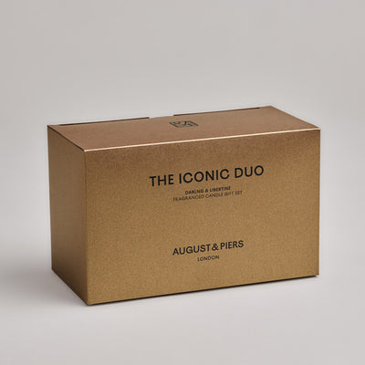 The Iconic Duo Gift Set by AUGUST&PIERS London. This set features the Darling and Libertine scented candles in limited-edition dark gold packaging.